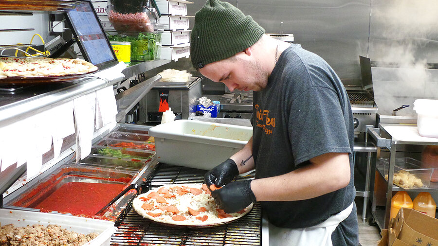 Building a pizza in the Twin Trees kitchen